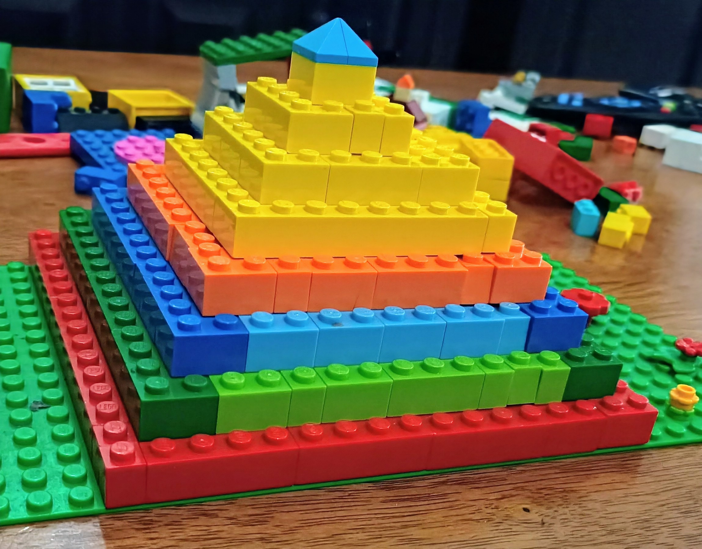 Lego pieces joined together to form a pyramid-like structure